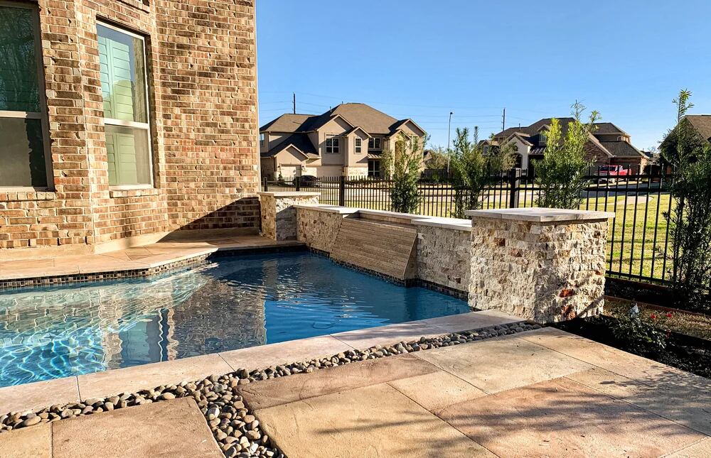 Pool with diving board, shade cabana and lounge seating